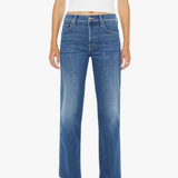 Woman wearing blue jeans and a white top on a white background