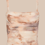 Ruched tank top with abstract pattern on a beige background