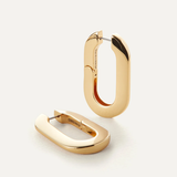 Gold hoop earrings on a white background