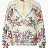 Neutral blouse with a streamlined, polished silhouette.