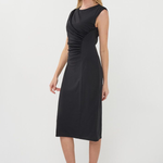 Woman wearing a black dress on a white background