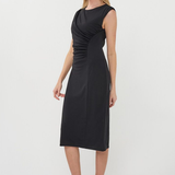 Woman wearing a black dress on a white background