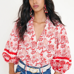 red printed long sleeve blouse  modeled against a white background