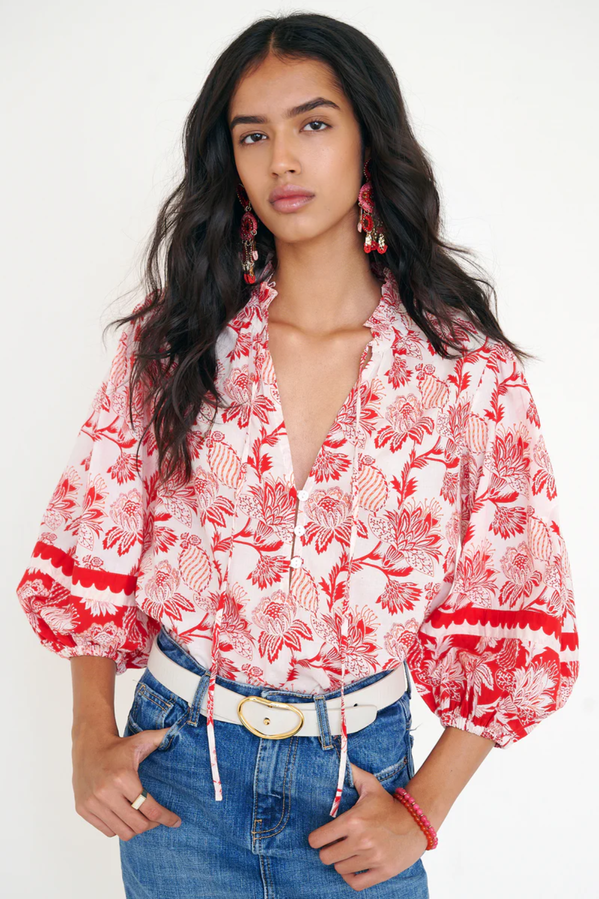 red printed long sleeve blouse  modeled against a white background