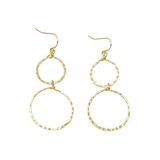 Gold hoop earrings on a white background