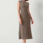 A woman modeling a sleeveless, ribbed knit midi dress in a taupe-brown color, paired with black slide sandals, against a plain light gray studio background.