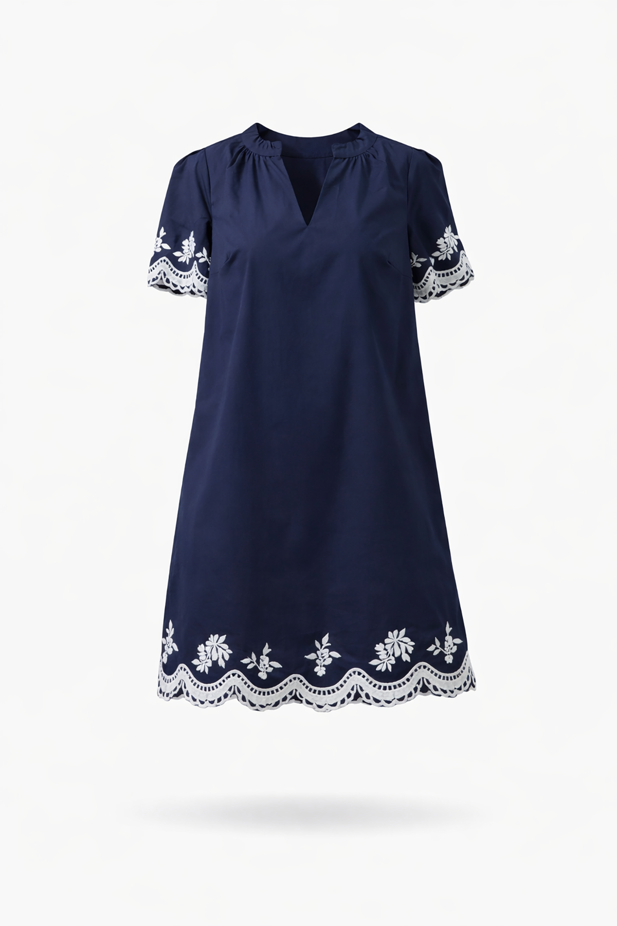 Navy blue dress with white lace details on a white background