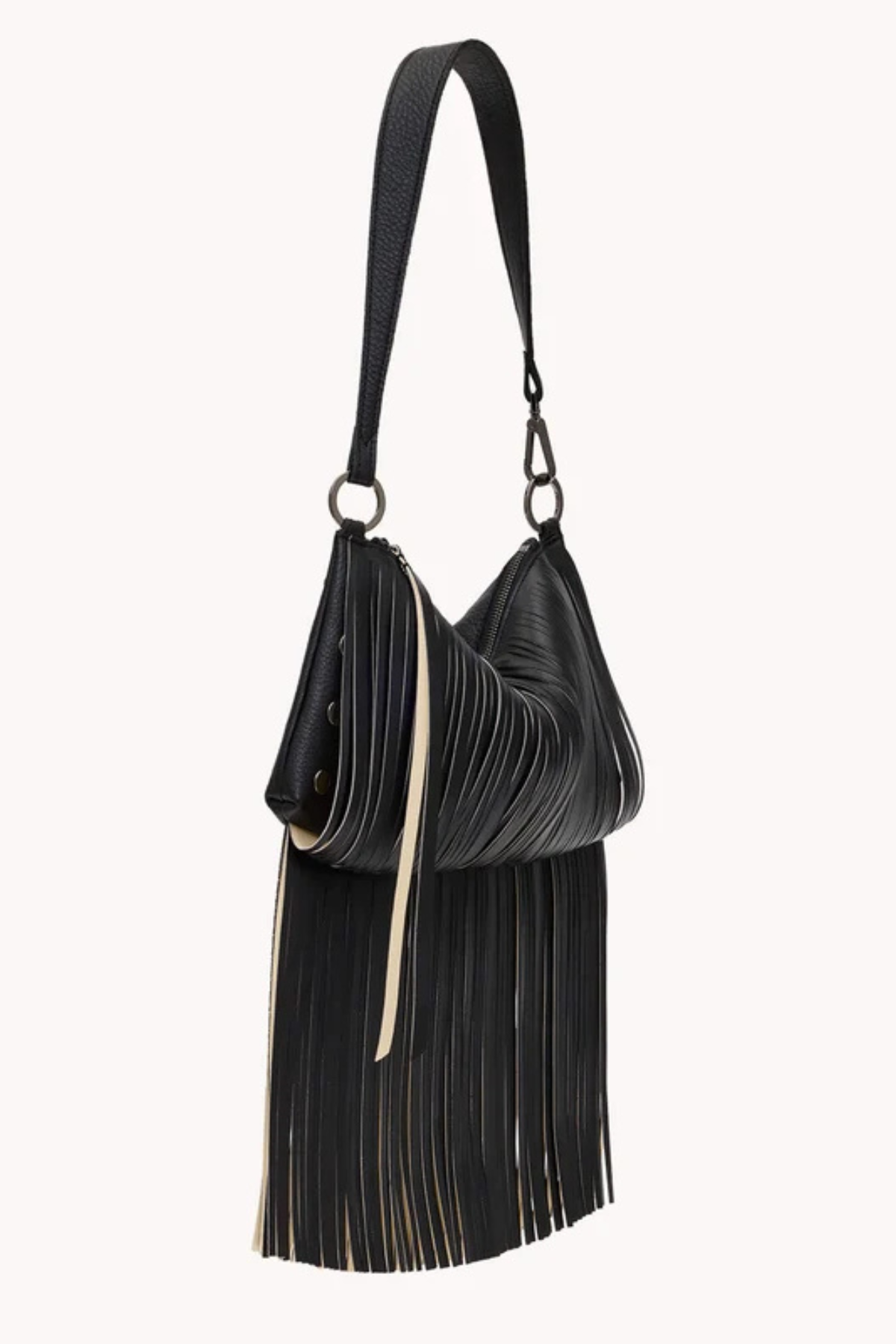 A black pleated leather shoulder bag with a long strap, a slouchy crescent shape, and a long fringe detail hanging from the bottom, shown against a plain off-white background.