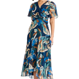 Model wearing a blue printed short-sleeve midi dress featuring a flattering waist and flowing skirt.