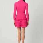 Vibrant pink dress with a sleek, structured silhouette, styled for a festive occasion