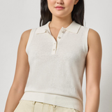 woman in white sleeveless top with collar 