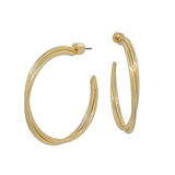 Gold hoop earrings on a white background