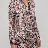 Leopard print pajama set with floral patterns on a plain background