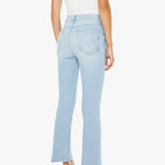 Light blue jeans worn by a person on a white background