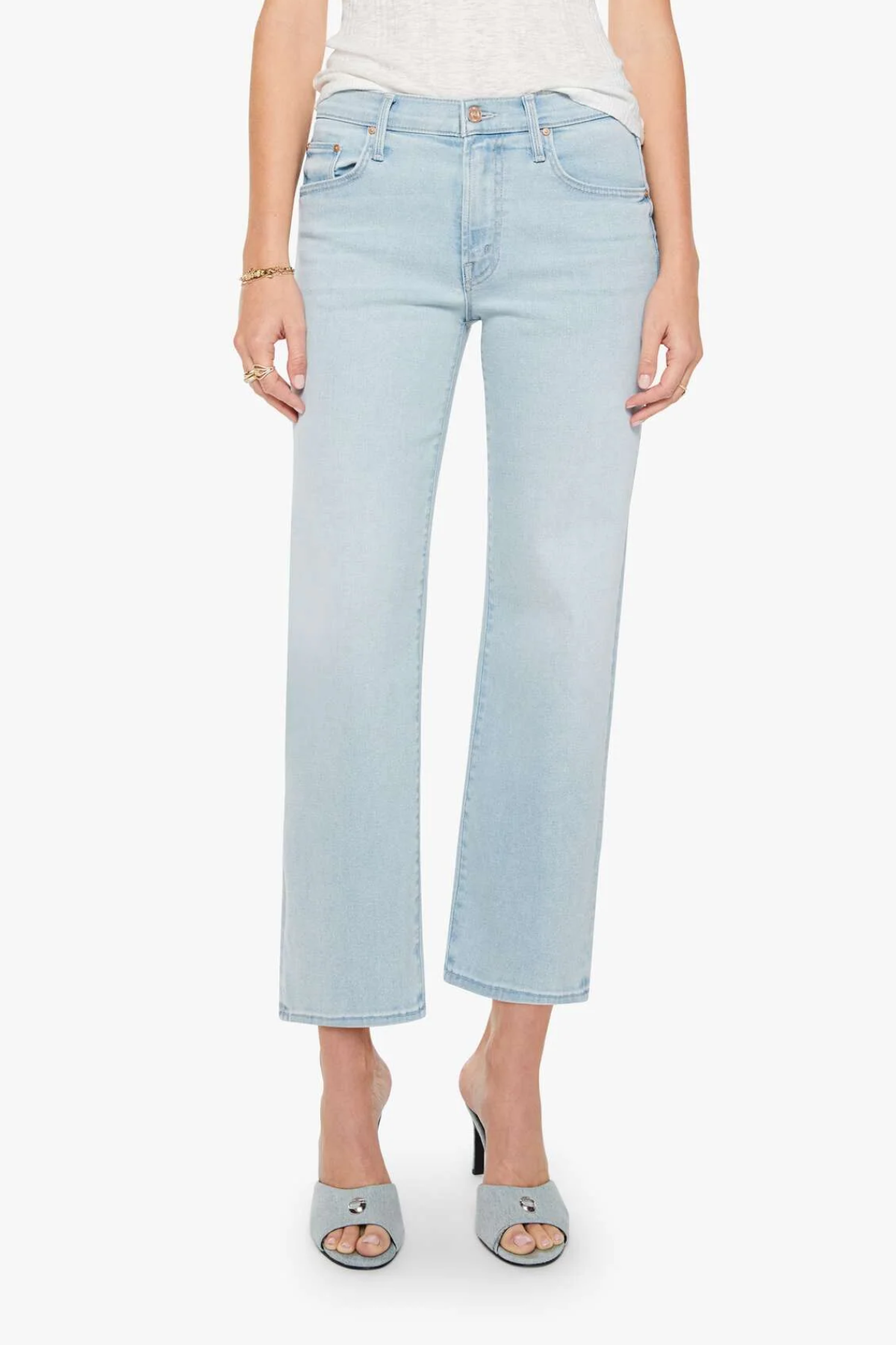 Light blue jeans worn by a person on a white background