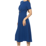 side view of woman in blue midi dress on white background 