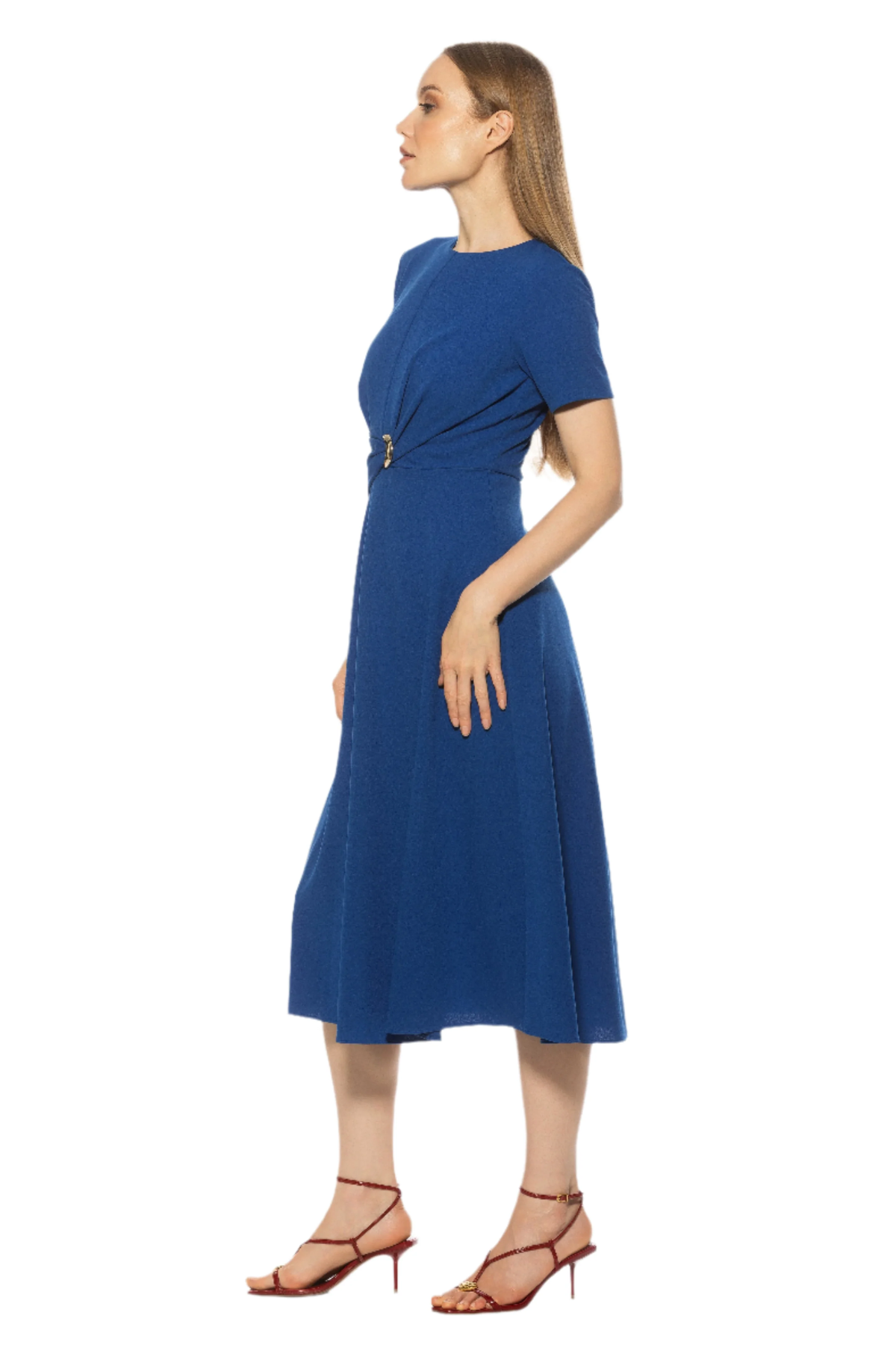 side view of woman in blue midi dress on white background 
