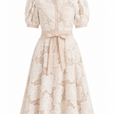 Beige lace dress with a belt on a white background