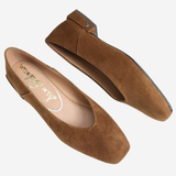 A pair of women's brown suede flats with square toes, shown from top and side angles on a light gray background. The brand name 'Jean Schlumber' is visible on the insole.
