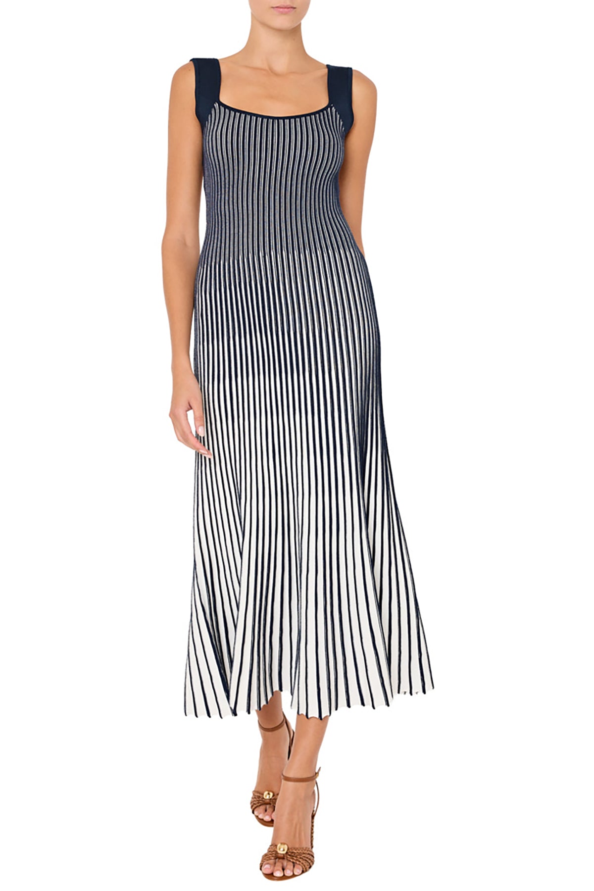 Woman wearing a black and white striped dress on a white background