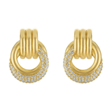 A pair of gold hoop earrings with a triple-band design and pavé-set clear stones along the lower curve, shown on a plain white background.