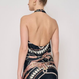 Model wearing a sleeveless printed halter top with a coordinating floral-inspired pattern and relaxed silhouette.