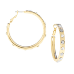 Gold hoop earrings with one having embedded stones on a white background