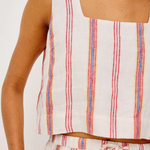 Striped sleeveless top and shorts set on a plain background