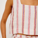 Striped sleeveless top and shorts set on a plain background