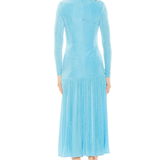 Woman wearing a light blue dress with long sleeves on a white background