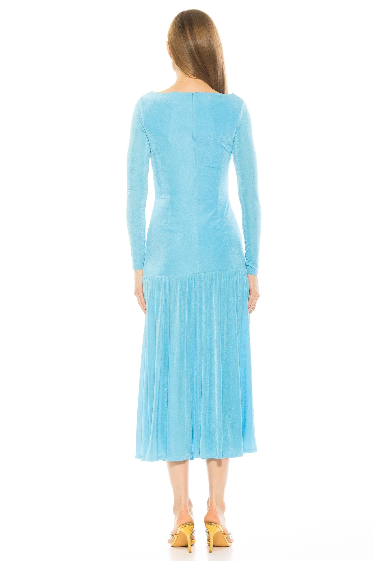 Woman wearing a light blue dress with long sleeves on a white background