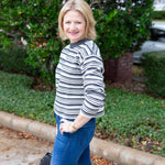 Long sleeve striped sweater with a round neckline.
