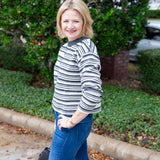 Long sleeve striped sweater with a round neckline.