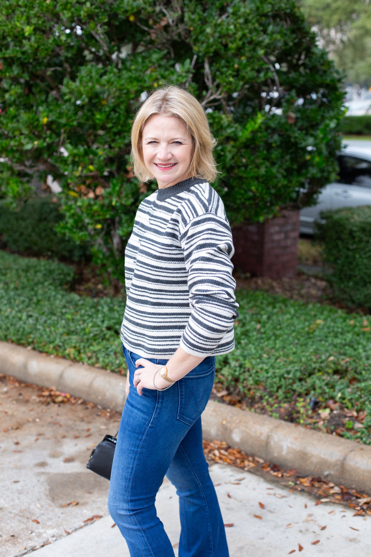 Long sleeve striped sweater with a round neckline.