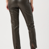 Brown leather pants worn by a person on a white background