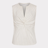 White sleeveless top with a knot detail on a white background