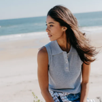 woman on beach in grey tank top 