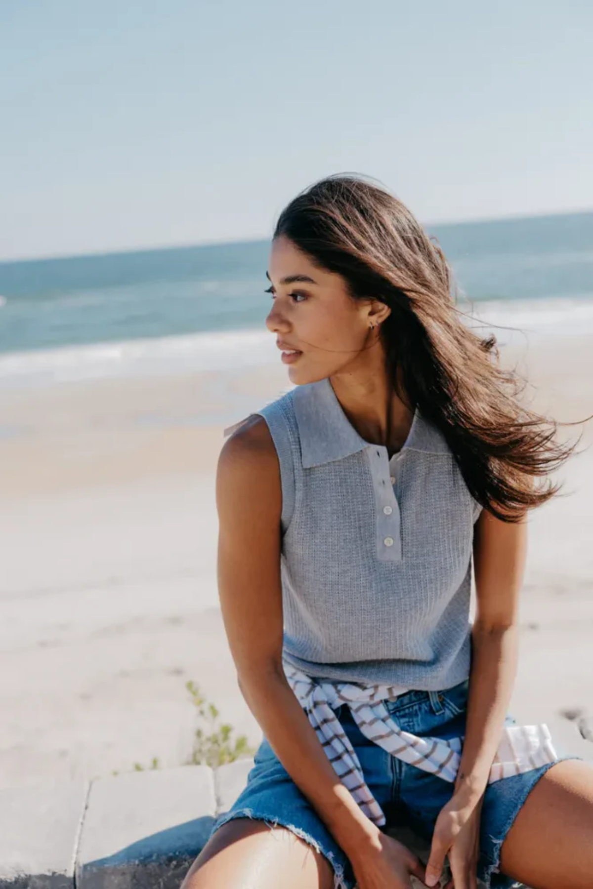 woman on beach in grey tank top 