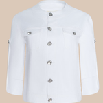 White jacket with silver buttons on a beige background