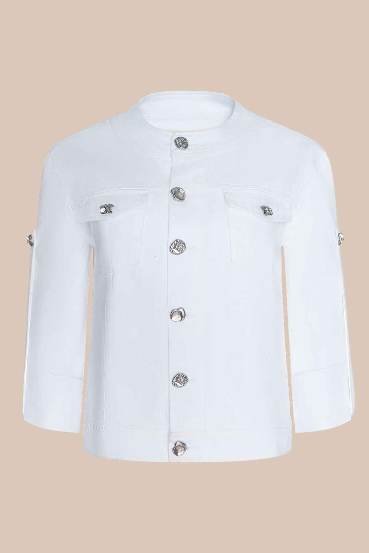 White jacket with silver buttons on a beige background