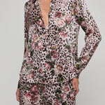 Leopard print pajama set with floral patterns on a gray background