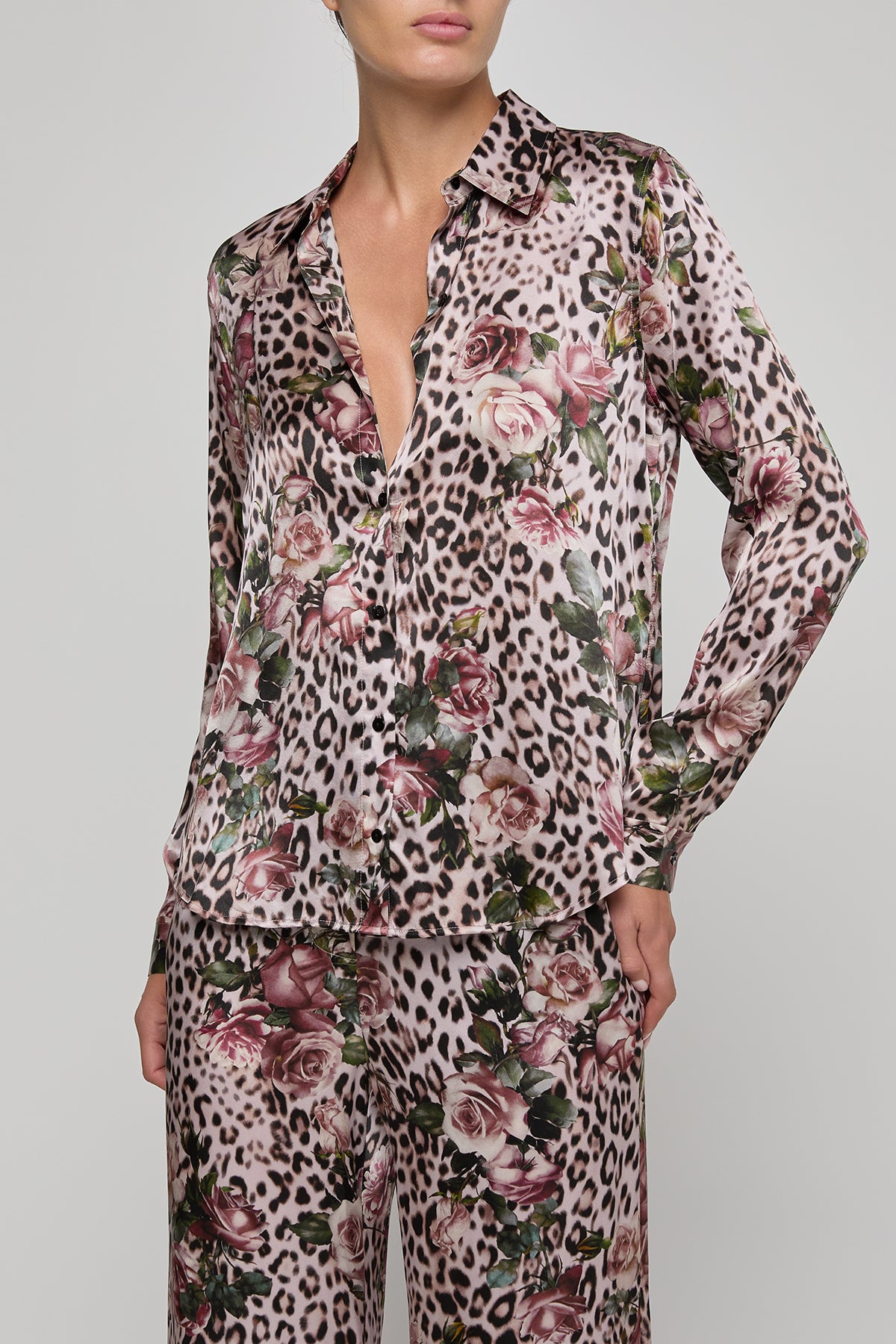 Leopard print pajama set with floral patterns on a gray background