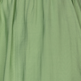 Close-up of a green skirt with a focus on texture and color.