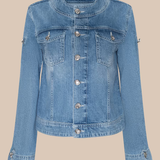 Blue denim jacket on a beige background