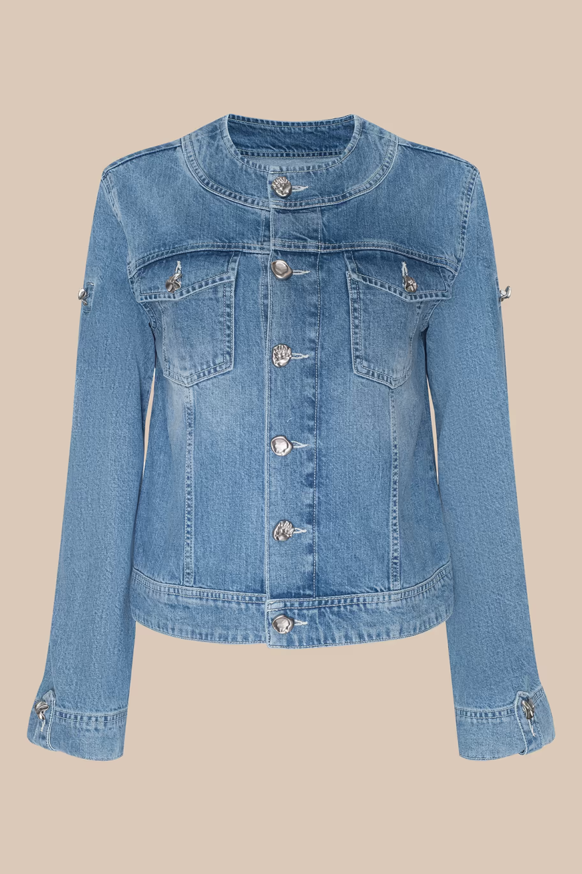 Blue denim jacket on a beige background