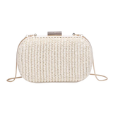 White woven clutch bag with pearl embellishments on a white background
