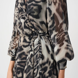 Leopard print dress worn by a person on a white background