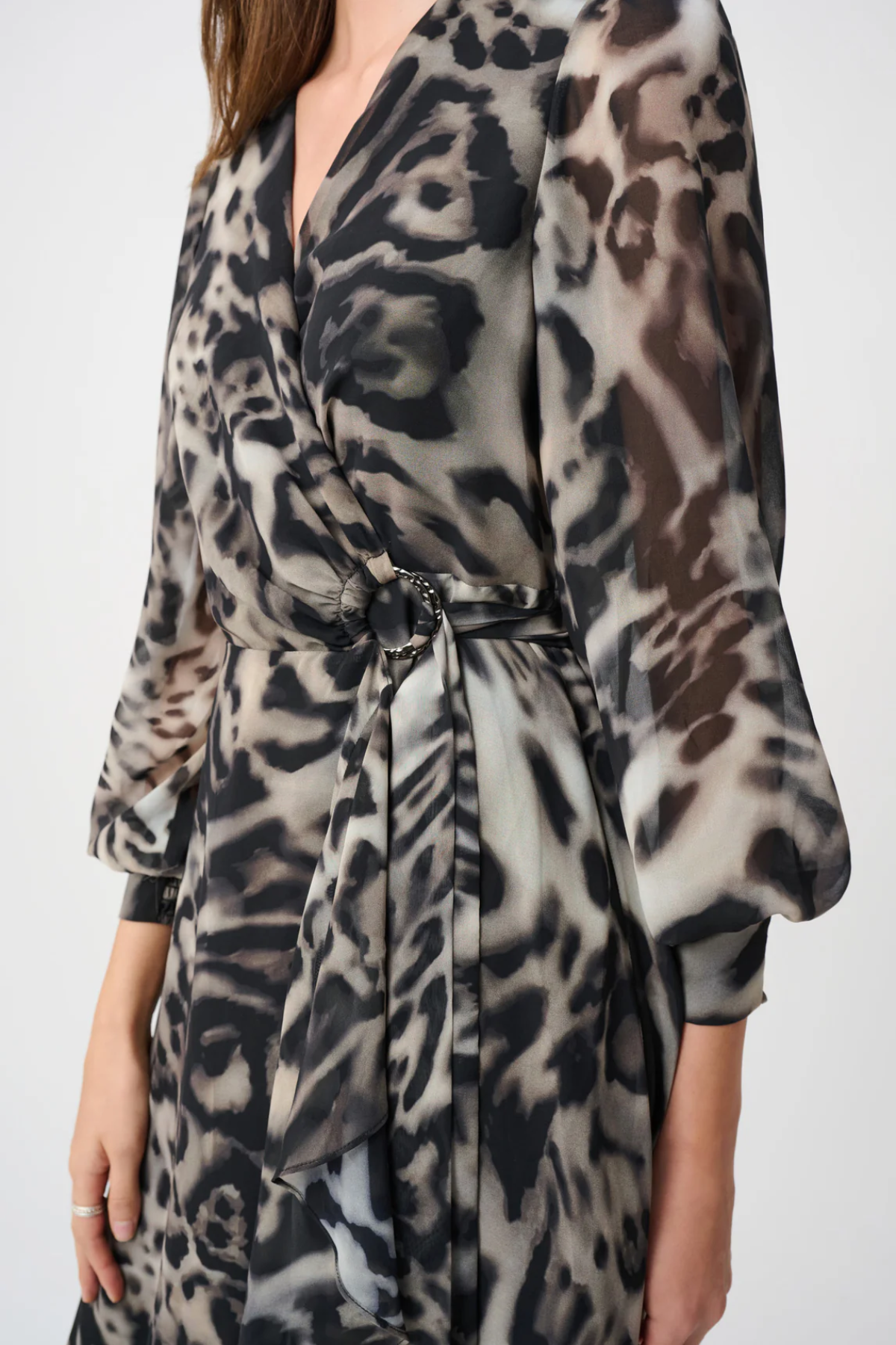 Leopard print dress worn by a person on a white background