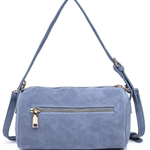 A dusty blue faux suede crossbody bag with a front zippered pocket and gold-tone hardware, shown on a plain white background.