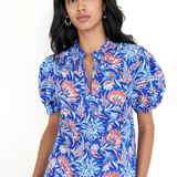 printed blue short sleeve top modeled against white background